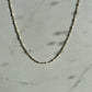 White enamel chain gold 
necklace