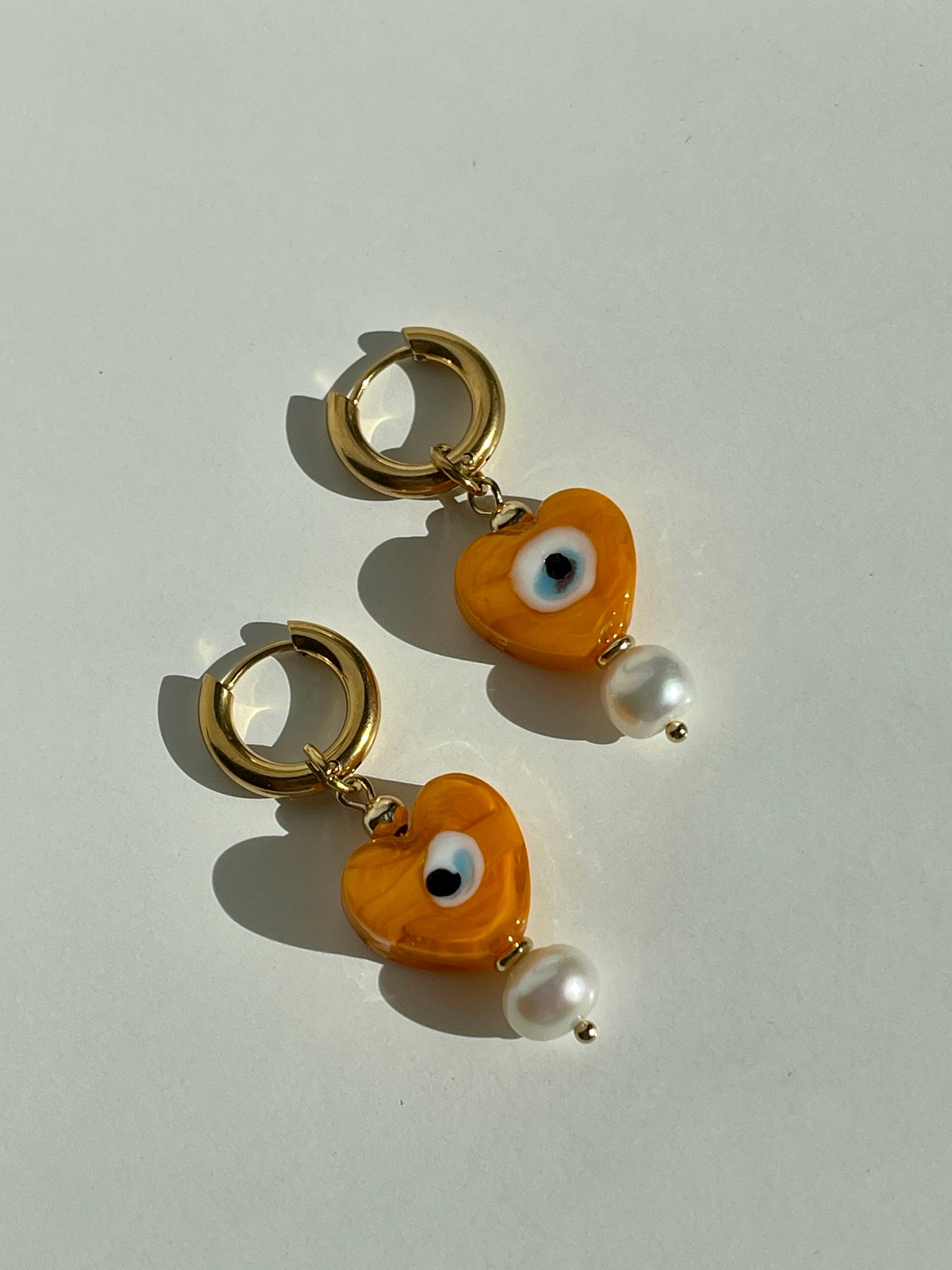 Orange heart evil eyes & fresh water pearl hoop earrings