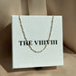 White enamel chain gold 
necklace