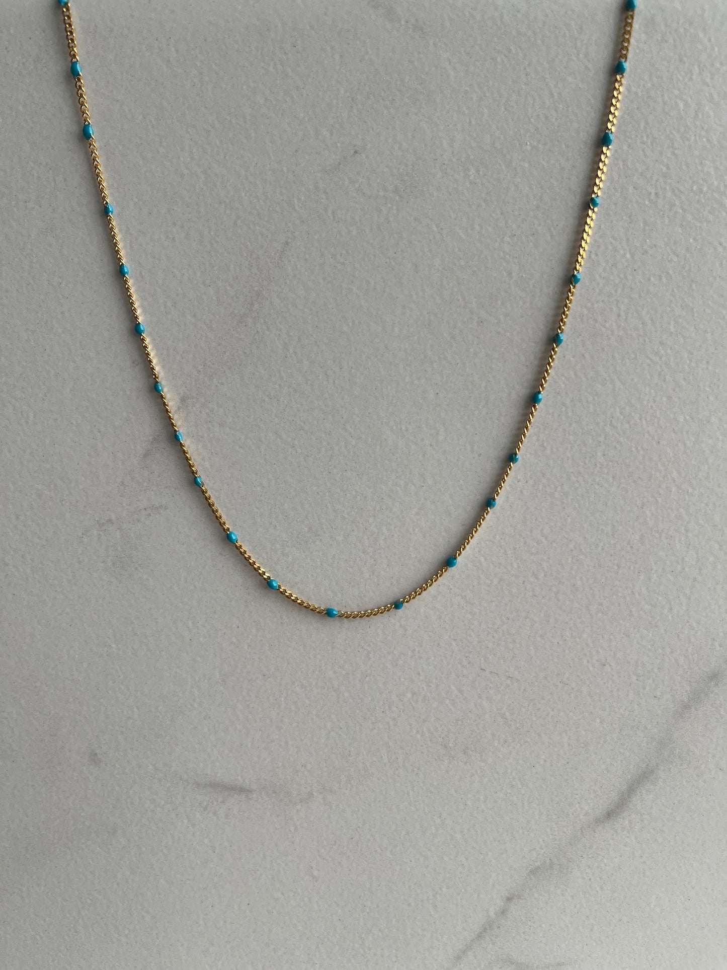 Turquoise enamel chain gold 
necklace