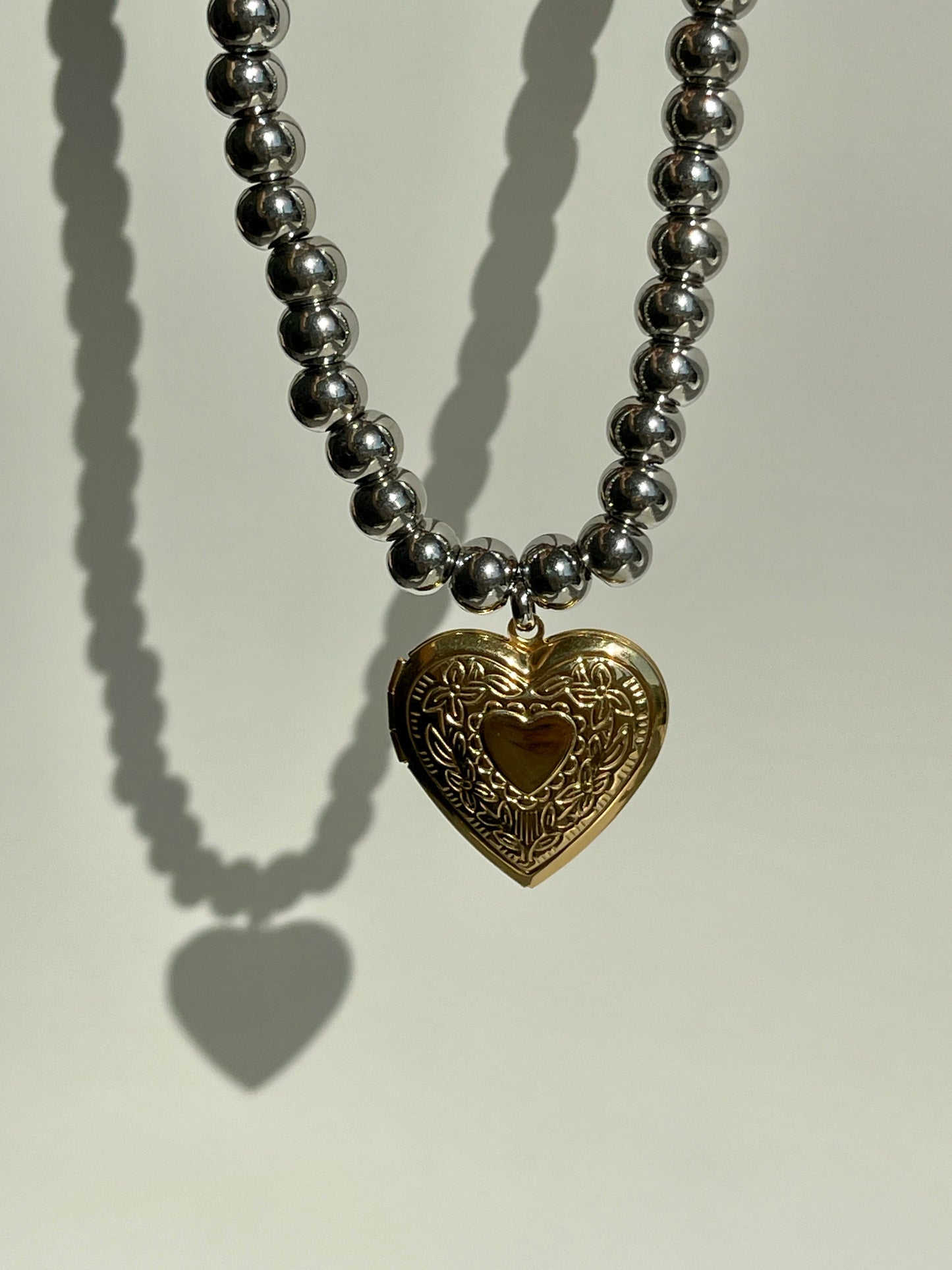 Gold heart locket pendant & chunky silver beaded necklace