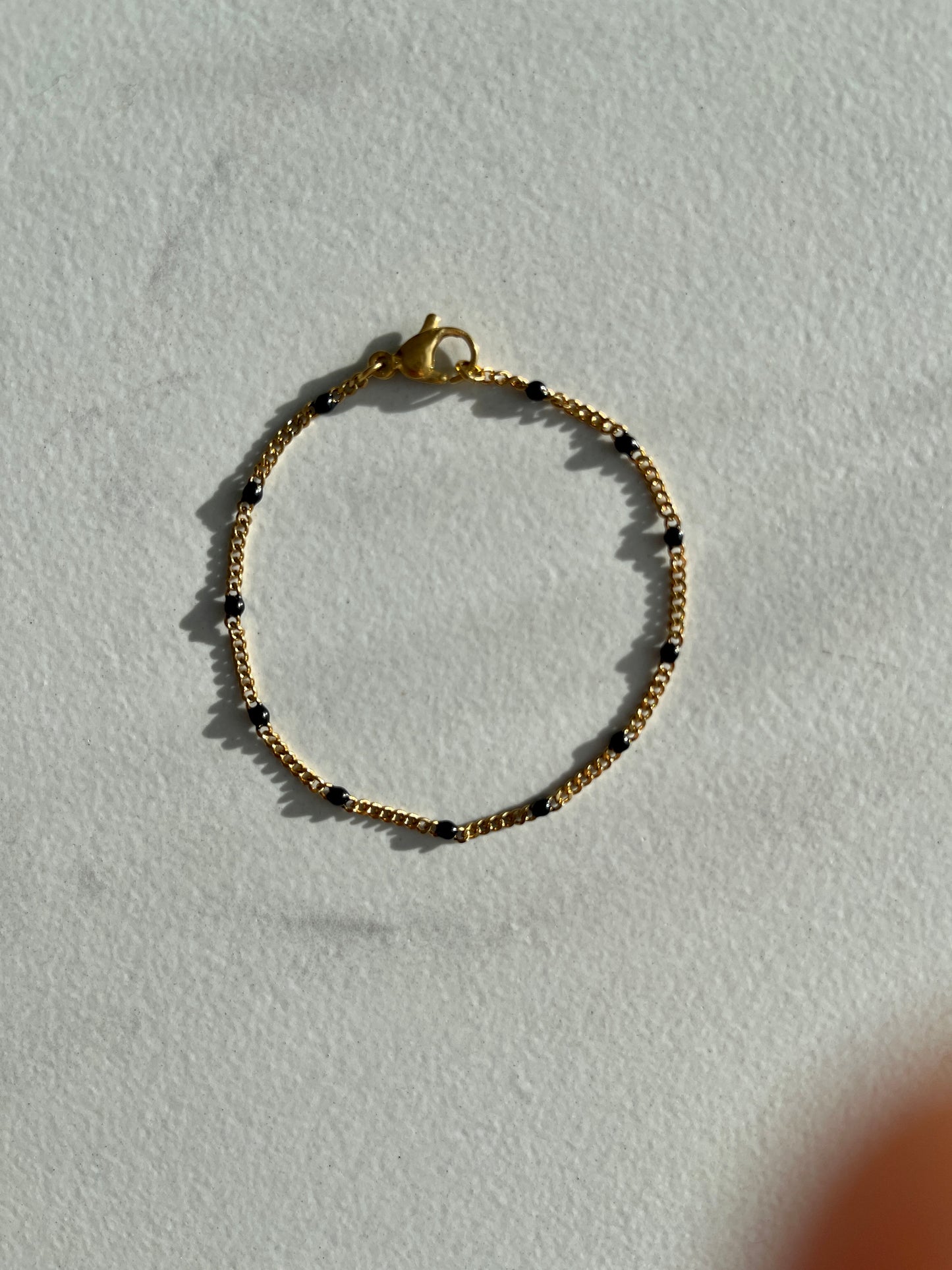 Black enamel chain gold bracelet