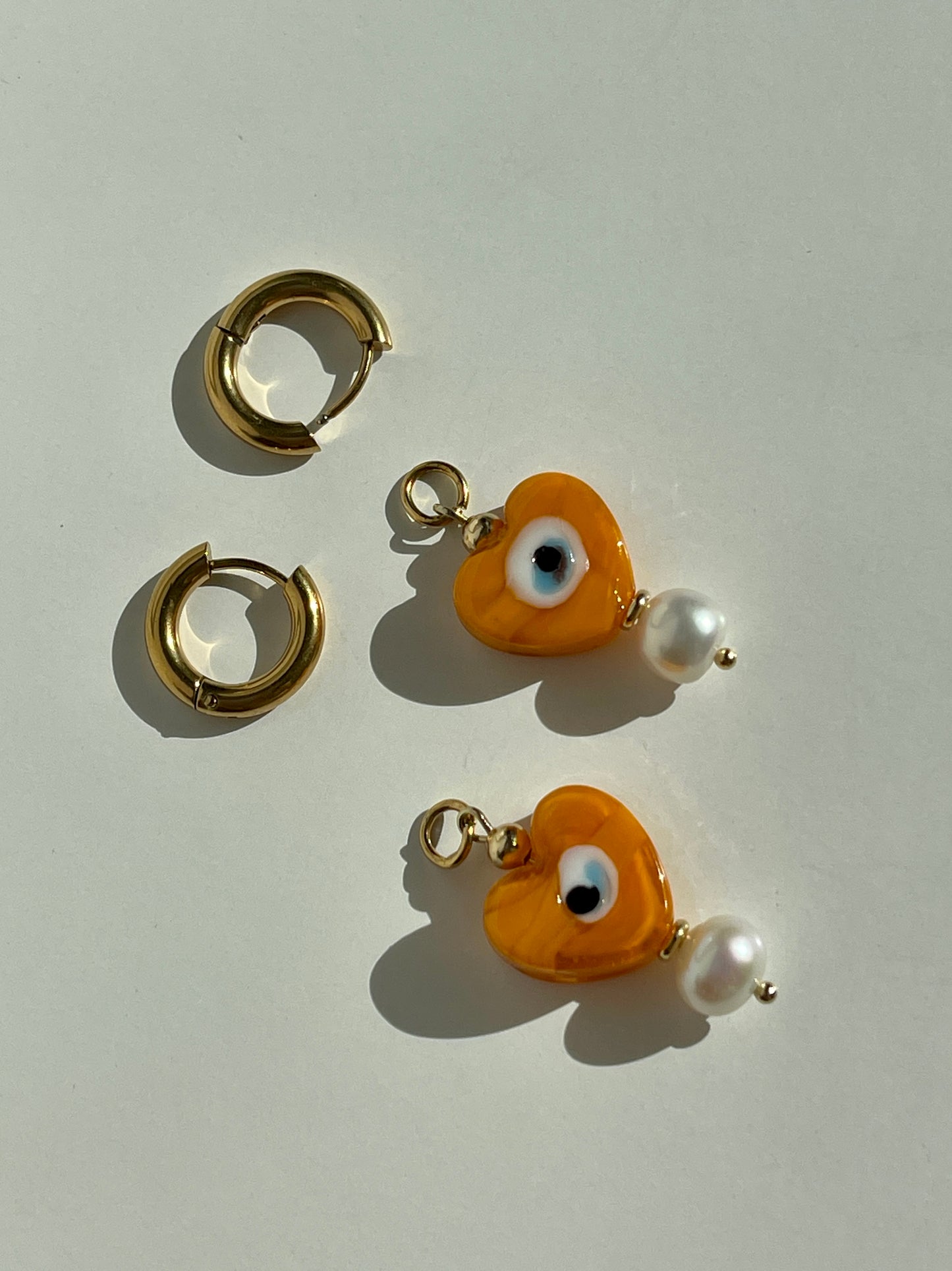 Orange heart evil eyes & fresh water pearl hoop earrings